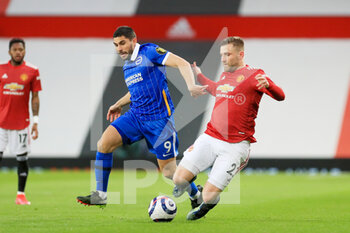 2021-04-04 - Brighton and Hove Albion forward Neal Maupay (9) battles with Manchester United Defender Luke Shaw during the English championship Premier League football match between Manchester United and Brighton and Hove Albion on April 4, 2021 at Old Trafford in Manchester, England - Photo Phil Duncan / ProSportsImages / DPPI - MANCHESTER UNITED VS BRIGHTON AND HOVE ALBION - ENGLISH PREMIER LEAGUE - SOCCER