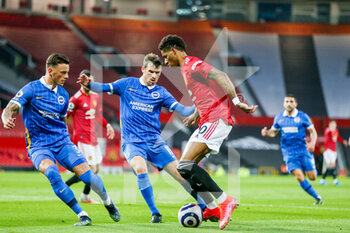 2021-04-04 - Manchester United Forward Marcus Rashford battles with Brighton and Hove Albion defender Ben White (3) and Brighton and Hove Albion midfielder Pascal Gross (13) during the English championship Premier League football match between Manchester United and Brighton and Hove Albion on April 4, 2021 at Old Trafford in Manchester, England - Photo Phil Duncan / ProSportsImages / DPPI - MANCHESTER UNITED VS BRIGHTON AND HOVE ALBION - ENGLISH PREMIER LEAGUE - SOCCER