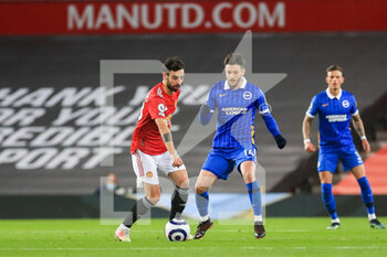 2021-04-04 - Manchester United Midfielder Bruno Fernandes battles with Brighton and Hove Albion midfielder Adam Lallana (14) during the English championship Premier League football match between Manchester United and Brighton and Hove Albion on April 4, 2021 at Old Trafford in Manchester, England - Photo Phil Duncan / ProSportsImages / DPPI - MANCHESTER UNITED VS BRIGHTON AND HOVE ALBION - ENGLISH PREMIER LEAGUE - SOCCER
