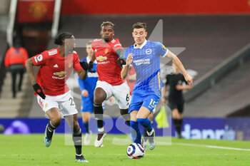 2021-04-04 - Brighton and Hove Albion midfielder Jakub Moder (15) battles with Manchester United Midfielder Paul Pogba and Manchester United defender Aaron Wan-Bissaka during the English championship Premier League football match between Manchester United and Brighton and Hove Albion on April 4, 2021 at Old Trafford in Manchester, England - Photo Phil Duncan / ProSportsImages / DPPI - MANCHESTER UNITED VS BRIGHTON AND HOVE ALBION - ENGLISH PREMIER LEAGUE - SOCCER