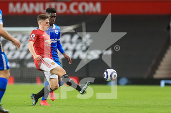 2021-04-04 - Manchester United Midfielder Daniel James battles with Brighton and Hove Albion midfielder Yves Bissouma (8) during the English championship Premier League football match between Manchester United and Brighton and Hove Albion on April 4, 2021 at Old Trafford in Manchester, England - Photo Phil Duncan / ProSportsImages / DPPI - MANCHESTER UNITED VS BRIGHTON AND HOVE ALBION - ENGLISH PREMIER LEAGUE - SOCCER