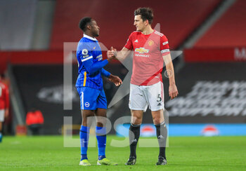 2021-04-04 - Manchester United defender Harry Maguire consoles Brighton and Hove Albion forward Danny Welbeck (18) after the English championship Premier League football match between Manchester United and Brighton and Hove Albion on April 4, 2021 at Old Trafford in Manchester, England - Photo Phil Duncan / ProSportsImages / DPPI - MANCHESTER UNITED VS BRIGHTON AND HOVE ALBION - ENGLISH PREMIER LEAGUE - SOCCER