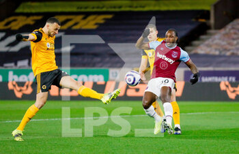 2021-04-05 - Wolverhampton Wanderers defender Romain Saiss (27) clears ahead of West Ham United forward Michail Antonio (30) during the English championship Premier League football match between Wolverhampton Wanderers and West Ham United on April 5, 2021 at Molineux in Wolverhampton, England - Photo Simon Davies / ProSportsImages / DPPI - WOLVERHAMPTON WANDERERS VS WEST HAM UNITED - ENGLISH PREMIER LEAGUE - SOCCER