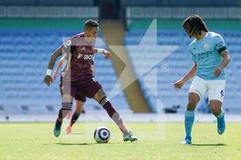 2021-04-10 - Leeds United forward Raphinha (18) and Nathan Ake of Manchester City during the English championship Premier League football match between Manchester City and Leeds United on April 10, 2021 at the Etihad Stadium in Manchester, England - Photo Malcolm Bryce / ProSportsImages / DPPI - MANCHESTER CITY AND LEEDS UNITED - ENGLISH PREMIER LEAGUE - SOCCER