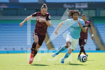 2021-04-10 - Leeds United defender Luke Ayling (2) and Nathan Ake of Manchester City during the English championship Premier League football match between Manchester City and Leeds United on April 10, 2021 at the Etihad Stadium in Manchester, England - Photo Malcolm Bryce / ProSportsImages / DPPI - MANCHESTER CITY AND LEEDS UNITED - ENGLISH PREMIER LEAGUE - SOCCER