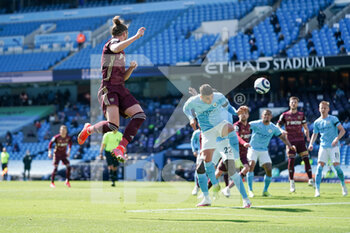 2021-04-10 - Leeds United defender Luke Ayling (2) headers the ball towards goal during the English championship Premier League football match between Manchester City and Leeds United on April 10, 2021 at the Etihad Stadium in Manchester, England - Photo Malcolm Bryce / ProSportsImages / DPPI - MANCHESTER CITY AND LEEDS UNITED - ENGLISH PREMIER LEAGUE - SOCCER