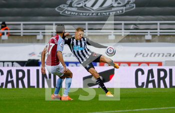2021-04-12 - Newcastle United forward Dwight Gayle (12) shoots during the English championship Premier League football match between Newcastle United and Aston Villa on March 12, 2021 at St James's Park in Newcastle, England - Photo Simon Davies / ProSportsImages / DPPI - NEWCASTLE UNITED AND ASTON VILLA - ENGLISH PREMIER LEAGUE - SOCCER