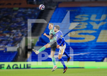 2021-04-13 - Lucas Digne of Everton battles in the air with Brighton and Hove Albion midfielder Pascal Gross (13) during the English championship Premier League football match between Brighton and Hove Albion and Everton on April 12, 2021 at the American Express Community Stadium in Brighton and Hove, England - Photo Phil Duncan / ProSportsImages / DPPI - BRIGHTON VS HOVE ALBION AND EVERTON - ENGLISH PREMIER LEAGUE - SOCCER