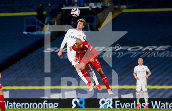 2021-04-19 - Leeds United forward Patrick Bamford (9) challenges in the air with Fabinho of Liverpool during the English championship Premier League football match between Leeds United and Liverpool on April 19, 2021 at Elland Road in Leeds, England - Photo Simon Davies / ProSportsImages / DPPI - LEEDS UNITED VS LIVERPOOL - ENGLISH PREMIER LEAGUE - SOCCER