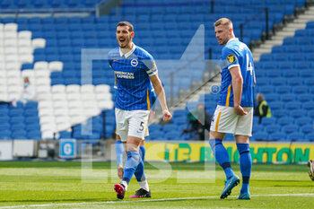 2021-05-01 - Brighton and Hove Albion defender Lewis Dunk (5) gestures and reacts towards the linesman during the English championship Premier League football match between Brighton and Hove Albion and Leeds United on May 1, 2021 at the American Express Community Stadium in Brighton and Hove, England - Photo Malcolm Bryce / ProSportsImages / DPPI - BRIGHTON AND HOVE ALBION VS LEEDS UNITED - ENGLISH PREMIER LEAGUE - SOCCER