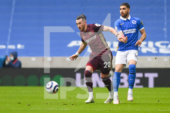 2021-05-01 - Leeds United midfielder Jack Harrison (22) and Alireza Jahanbakhsh of Brighton during the English championship Premier League football match between Brighton and Hove Albion and Leeds United on May 1, 2021 at the American Express Community Stadium in Brighton and Hove, England - Photo Malcolm Bryce / ProSportsImages / DPPI - BRIGHTON AND HOVE ALBION VS LEEDS UNITED - ENGLISH PREMIER LEAGUE - SOCCER