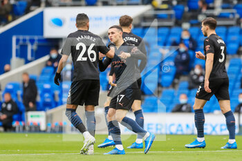 2021-05-18 - Manchester City midfielder Phil Foden (47) celebrates with Manchester City midfielder Riyad Mahrez (26) after Manchester City ?lkay Gundogan (8) (Not in picture) goal during the English championship Premier League football match between Brighton and Hove Albion and Manchester City on May 18, 2021 at the American Express Community Stadium in Brighton and Hove, England - Photo Phil Duncan / ProSportsImages / DPPI - BRIGHTON AND HOVE ALBION VS MANCHESTER CITY - ENGLISH PREMIER LEAGUE - SOCCER