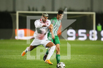 2020-10-01 - Theo Hernandez of Milan in action with Diego Lopes of Rio Ave during the UEFA Europa League, qualifying play-offs football match between Rio Ave FC and AC Milan on October 1, 2020 at Estadio dos Arcos in Vila do Conde, Portugal - Photo Nuno Guimaraes / ProSportsImages / DPPI - RIO AVE FC VS AC MILAN - UEFA EUROPA LEAGUE - SOCCER