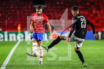 2020-10-29 - Antonio Puertas of Granada and Dimitrios Giannoulis of Paok during the UEFA Europa League, Group Stage, Group E football match between Granada CF and Paok FC on October 29, 2020 at Los Carmenes Stadium in Granada, Spain - Photo Joaquin Corchero / Spain DPPI / DPPI - GRANADA CF VS PAOK FC - UEFA EUROPA LEAGUE - SOCCER