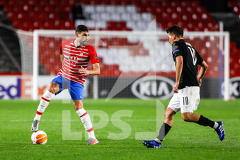 2020-10-29 - Antonio Puertas of Granada and Thomas Murg of Paok during the UEFA Europa League, Group Stage, Group E football match between Granada CF and Paok FC on October 29, 2020 at Los Carmenes Stadium in Granada, Spain - Photo Joaquin Corchero / Spain DPPI / DPPI - GRANADA CF VS PAOK FC - UEFA EUROPA LEAGUE - SOCCER
