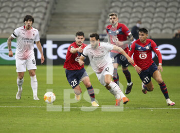 2020-11-26 - Jeremy Pied of Lille, Hakan Calhanoglu of AC Milan, Luiz Araujo of Lille during the UEFA Europa League, Group H football match between Lille OSC and AC Milan on November 26, 2020 at Pierre Mauroy stadium in Villeneuve-d'Ascq near Lille, France - Photo Jean Catuffe / DPPI - LILLE OSC VS AC MILAN - UEFA EUROPA LEAGUE - SOCCER