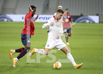2020-11-26 - Diogo Dalot of AC Milan, Jonathan Bamba of Lille (left) during the UEFA Europa League, Group H football match between Lille OSC and AC Milan on November 26, 2020 at Pierre Mauroy stadium in Villeneuve-d'Ascq near Lille, France - Photo Jean Catuffe / DPPI - LILLE OSC VS AC MILAN - UEFA EUROPA LEAGUE - SOCCER