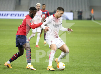 2020-11-26 - Diogo Dalot of AC Milan, Jonathan Bamba of Lille (left) during the UEFA Europa League, Group H football match between Lille OSC and AC Milan on November 26, 2020 at Pierre Mauroy stadium in Villeneuve-d'Ascq near Lille, France - Photo Jean Catuffe / DPPI - LILLE OSC VS AC MILAN - UEFA EUROPA LEAGUE - SOCCER