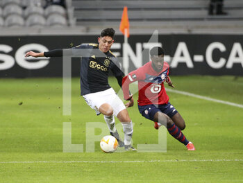 2021-02-18 - Edson Alvarez of Ajax, Jonathan Bamba of Lille during the UEFA Europa League, round of 32, 1st leg football match between Lille OSC (LOSC) and AFC Ajax Amsterdam on February 18, 2021 at Stade Pierre Mauroy in Villeneuve-d'Ascq near Lille, France - Photo Jean Catuffe / DPPI - LILLE OSC (LOSC) AND AFC AJAX AMSTERDAM - UEFA EUROPA LEAGUE - SOCCER