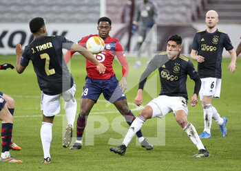 2021-02-18 - Jonathan David of Lille, Edson Alvarez of Ajax during the UEFA Europa League, round of 32, 1st leg football match between Lille OSC (LOSC) and AFC Ajax Amsterdam on February 18, 2021 at Stade Pierre Mauroy in Villeneuve-d'Ascq near Lille, France - Photo Jean Catuffe / DPPI - LILLE OSC (LOSC) AND AFC AJAX AMSTERDAM - UEFA EUROPA LEAGUE - SOCCER