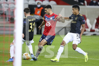 2021-02-18 - Mehmet Zeki Celik of Lille, David Neres of Ajax during the UEFA Europa League, round of 32, 1st leg football match between Lille OSC (LOSC) and AFC Ajax Amsterdam on February 18, 2021 at Stade Pierre Mauroy in Villeneuve-d'Ascq near Lille, France - Photo Jean Catuffe / DPPI - LILLE OSC (LOSC) AND AFC AJAX AMSTERDAM - UEFA EUROPA LEAGUE - SOCCER