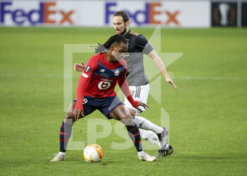 2021-02-18 - Renato Sanches of Lille, Daley Blind of Ajax during the UEFA Europa League, round of 32, 1st leg football match between Lille OSC (LOSC) and AFC Ajax Amsterdam on February 18, 2021 at Stade Pierre Mauroy in Villeneuve-d'Ascq near Lille, France - Photo Jean Catuffe / DPPI - LILLE OSC (LOSC) AND AFC AJAX AMSTERDAM - UEFA EUROPA LEAGUE - SOCCER