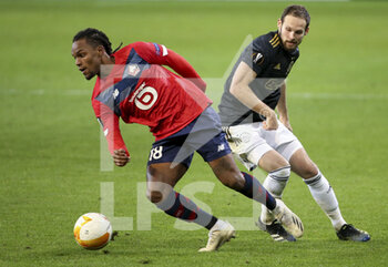2021-02-18 - Renato Sanches of Lille, Daley Blind of Ajax during the UEFA Europa League, round of 32, 1st leg football match between Lille OSC (LOSC) and AFC Ajax Amsterdam on February 18, 2021 at Stade Pierre Mauroy in Villeneuve-d'Ascq near Lille, France - Photo Jean Catuffe / DPPI - LILLE OSC (LOSC) AND AFC AJAX AMSTERDAM - UEFA EUROPA LEAGUE - SOCCER