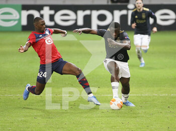 2021-02-18 - Brian Brobbey of Ajax, Boubakary Soumare of Lille (left) during the UEFA Europa League, round of 32, 1st leg football match between Lille OSC (LOSC) and AFC Ajax Amsterdam on February 18, 2021 at Stade Pierre Mauroy in Villeneuve-d'Ascq near Lille, France - Photo Jean Catuffe / DPPI - LILLE OSC (LOSC) AND AFC AJAX AMSTERDAM - UEFA EUROPA LEAGUE - SOCCER