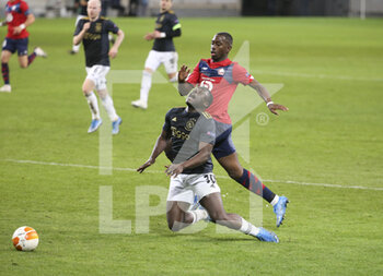 2021-02-18 - Brian Brobbey of Ajax, Boubakary Soumare of Lille during the UEFA Europa League, round of 32, 1st leg football match between Lille OSC (LOSC) and AFC Ajax Amsterdam on February 18, 2021 at Stade Pierre Mauroy in Villeneuve-d'Ascq near Lille, France - Photo Jean Catuffe / DPPI - LILLE OSC (LOSC) AND AFC AJAX AMSTERDAM - UEFA EUROPA LEAGUE - SOCCER