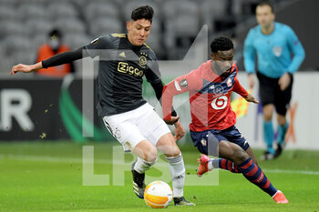 2021-02-18 - Edson Alvarez of Ajax, Jonathan Bamba of Lille OSC during the UEFA Europa League, round of 32, 1st leg football match between LOSC Lille and AFC Ajax on February 18, 2021 at Pierre Mauroy stadium in Villeneuve-d'Ascq near Lille, France - Photo Gerrit van Keulen / Orange Pictures / DPPI - LOSC LILLE AND AFC AJAX - UEFA EUROPA LEAGUE - SOCCER