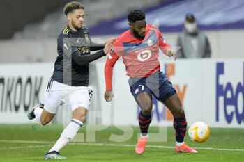 2021-02-18 - Devyne Rensch of Ajax, Jonathan Bamba of Lille OSC during the UEFA Europa League, round of 32, 1st leg football match between LOSC Lille and AFC Ajax on February 18, 2021 at Pierre Mauroy stadium in Villeneuve-d'Ascq near Lille, France - Photo Gerrit van Keulen / Orange Pictures / DPPI - LOSC LILLE AND AFC AJAX - UEFA EUROPA LEAGUE - SOCCER