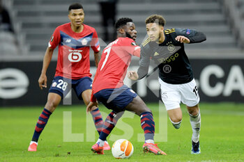 2021-02-18 - Jonathan Bamba of Lille OSC, Devyne Rensch of Ajax during the UEFA Europa League, round of 32, 1st leg football match between LOSC Lille and AFC Ajax on February 18, 2021 at Pierre Mauroy stadium in Villeneuve-d'Ascq near Lille, France - Photo Gerrit van Keulen / Orange Pictures / DPPI - LOSC LILLE AND AFC AJAX - UEFA EUROPA LEAGUE - SOCCER