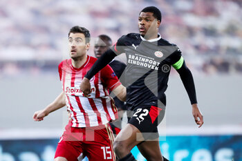 2021-02-18 - Sokratis Papastathopoulos of Olympiacos, Denzel Dumfries of PSV during the UEFA Europa League, round of 32, 1st leg football match between Olympiacos and PSV on February 18, 2021 at Stadio Georgios Karaiskakis in Piraeus, Greece - Photo Lato Klodian / Orange Pictures / DPPI - OLYMPIACOS AND PSV - UEFA EUROPA LEAGUE - SOCCER