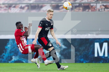 2021-02-18 - Mohamed Camara of Olympiacos, Timo Baumgartl of PSV during the UEFA Europa League, round of 32, 1st leg football match between Olympiacos and PSV on February 18, 2021 at Stadio Georgios Karaiskakis in Piraeus, Greece - Photo Lato Klodian / Orange Pictures / DPPI - OLYMPIACOS AND PSV - UEFA EUROPA LEAGUE - SOCCER