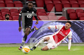 2021-02-25 - Jonathan Ikone of Lille OSC, Edson Alvarez of Ajax during the UEFA Europa League, round of 32, 2nd leg football match between Ajax and Lille OSC on February 25, 2021 at Johan Cruijf Arena in Amsterdam, Netherlands - Photo Marcel ter Bals / Orange Pictures / DPPI - AJAX AND LILLE OSC - UEFA EUROPA LEAGUE - SOCCER