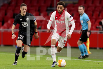 2021-02-25 - Domagoj Bradaric of Lille OSC, Devyne Rensch of Ajax during the UEFA Europa League, round of 32, 2nd leg football match between Ajax and Lille OSC on February 25, 2021 at Johan Cruijf Arena in Amsterdam, Netherlands - Photo Marcel ter Bals / Orange Pictures / DPPI - AJAX AND LILLE OSC - UEFA EUROPA LEAGUE - SOCCER