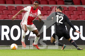 2021-02-25 - Ryan Gravenberch of Ajax, Yusuf Yazici of Lille OSC during the UEFA Europa League, round of 32, 2nd leg football match between Ajax and Lille OSC on February 25, 2021 at Johan Cruijf Arena in Amsterdam, Netherlands - Photo Marcel ter Bals / Orange Pictures / DPPI - AJAX AND LILLE OSC - UEFA EUROPA LEAGUE - SOCCER