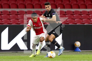 2021-02-25 - David Neres of Ajax, Zeki Celik of Lille OSC during the UEFA Europa League, round of 32, 2nd leg football match between Ajax and Lille OSC on February 25, 2021 at Johan Cruijf Arena in Amsterdam, Netherlands - Photo Marcel ter Bals / Orange Pictures / DPPI - AJAX AND LILLE OSC - UEFA EUROPA LEAGUE - SOCCER