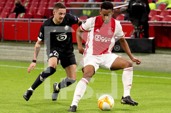 2021-02-25 - Domagoj Bradaric of Lille OSC, Jurrien Timber of Ajax during the UEFA Europa League, round of 32, 2nd leg football match between Ajax and Lille OSC on February 25, 2021 at Johan Cruijf Arena in Amsterdam, Netherlands - Photo Marcel ter Bals / Orange Pictures / DPPI - AJAX AND LILLE OSC - UEFA EUROPA LEAGUE - SOCCER
