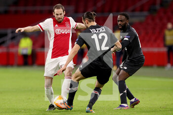 2021-02-25 - Daley Blind of Ajax, Yusuf Yazici of Lille OSC during the UEFA Europa League, round of 32, 2nd leg football match between Ajax and Lille OSC on February 25, 2021 at Johan Cruijf Arena in Amsterdam, Netherlands - Photo Marcel ter Bals / Orange Pictures / DPPI - AJAX AND LILLE OSC - UEFA EUROPA LEAGUE - SOCCER