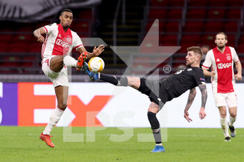 2021-02-25 - Ryan Gravenberch of Ajax, Xeka of Lille OSC during the UEFA Europa League, round of 32, 2nd leg football match between Ajax and Lille OSC on February 25, 2021 at Johan Cruijf Arena in Amsterdam, Netherlands - Photo Marcel ter Bals / Orange Pictures / DPPI - AJAX AND LILLE OSC - UEFA EUROPA LEAGUE - SOCCER
