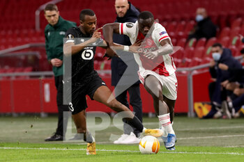 2021-02-25 - Tiago Djalo of Lille OSC, Brian Brobbey of Ajax during the UEFA Europa League, round of 32, 2nd leg football match between Ajax and Lille OSC on February 25, 2021 at Johan Cruijf Arena in Amsterdam, Netherlands - Photo Marcel ter Bals / Orange Pictures / DPPI - AJAX AND LILLE OSC - UEFA EUROPA LEAGUE - SOCCER