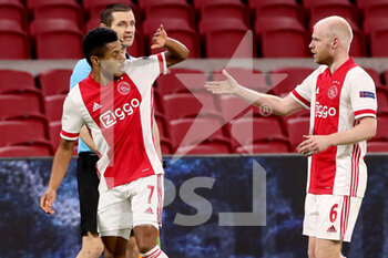 2021-02-25 - David Neres of Ajax celebrates his goal with Davy Klaassen during the UEFA Europa League, round of 32, 2nd leg football match between Ajax and Lille OSC on February 25, 2021 at Johan Cruijf Arena in Amsterdam, Netherlands - Photo Marcel ter Bals / Orange Pictures / DPPI - AJAX AND LILLE OSC - UEFA EUROPA LEAGUE - SOCCER