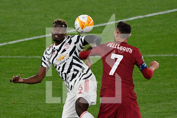 2021-05-06 - Paul Pogba of Manchester United and Lorenzo Pellegrini of AS Roma seen in action during the UEFA Europa League Quarter Finals football match between AS Roma and Manchester United at the Olimpic Stadium in Rome. - AS ROMA VS MANCHESTER UNITED - UEFA EUROPA LEAGUE - SOCCER