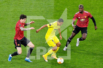 2021-05-26 - Carlos Bacca of Villarreal CF battles for posession with Victor Lindelof of Manchester United and Paul Pogba of Manchester United during the UEFA Europa League, Final football match between Villarreal CF and Manchester United on May 26, 2021 at Stadion Energa Gdansk in Gdansk, Poland - Photo Pablo Morano / Orange Pictures / DPPI - FINAL - VILLARREAL CF VS MANCHESTER UNITED - UEFA EUROPA LEAGUE - SOCCER