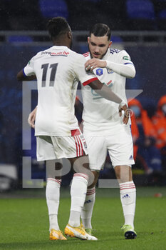 2021-02-09 - Rayan CHERKI of Lyon and Maxwel CORNET of Lyon during the French Cup, round of 64 football match between Olympique Lyonnais and AC Ajaccio on February 9, 2021 at Groupama Stadium in DÃ©cines-Charpieu near Lyon, France - Photo Romain Biard / Isports / DPPI - OLYMPIQUE LYONNAIS AND AC AJACCIO - FRENCH CUP - SOCCER