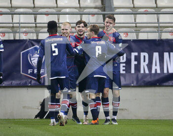 09/02/2021 - Baptiste Guillaume of Valenciennes (right) celebrates his goal with teammates during the French Cup, round of 64 football match between Stade de Reims and Valenciennes FC on February 9, 2021 at Auguste Delaune stadium in Reims, France - Photo Jean Catuffe / DPPI - STADE DE REIMS AND VALENCIENNES FC - FRENCH CUP - CALCIO