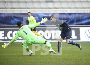 2021-02-10 - Dario Benedetto of Marseille, goalkeeper of Auxerre Sonny Laiton during the French Cup, round of 64 football match between AJ Auxerre (AJA) and Olympique de Marseille (OM) on February 10, 2021 at Stade Abbe Deschamps in Auxerre, France - Photo Jean Catuffe / DPPI - AJ AUXERRE AND OLYMPIQUE DE MARSEILLE - FRENCH CUP - SOCCER