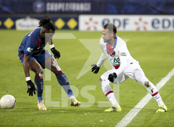 2021-02-10 - Neymar Jr of PSG, Steeve Yago of Caen (left) during the French Cup, round of 64 football match between Stade Malherbe de Caen (SM Caen) and Paris Saint-Germain (PSG) on February 10, 2021 at Stade Michel d'Ornano in Caen, France - Photo Jean Catuffe / DPPI - STADE MALHERBE DE CAEN (SM CAEN) AND PARIS SAINT-GERMAIN (PSG) - FRENCH CUP - SOCCER