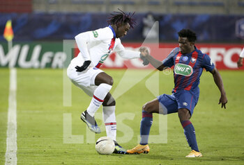 2021-02-10 - Moise Kean of PSG, Aloys Fouda of Caen during the French Cup, round of 64 football match between Stade Malherbe de Caen (SM Caen) and Paris Saint-Germain (PSG) on February 10, 2021 at Stade Michel d'Ornano in Caen, France - Photo Jean Catuffe / DPPI - STADE MALHERBE DE CAEN (SM CAEN) AND PARIS SAINT-GERMAIN (PSG) - FRENCH CUP - SOCCER